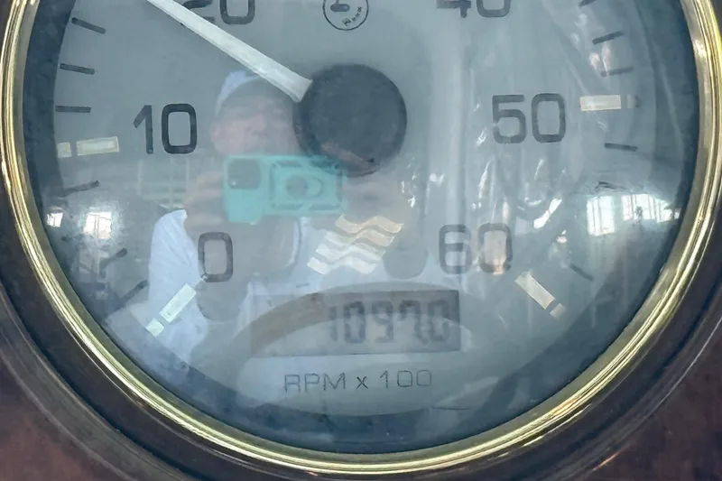Slide: The Image of Close-up of a 2004 Four Winns 298 Vista tachometer showing 1090 RPM. - 25