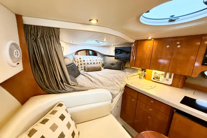 Slide: The Image of Interior of 2004 Four Winns 298 Vista yacht with cozy bed and kitchenette. - 30