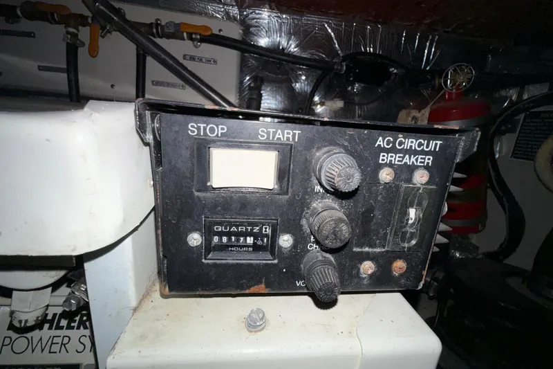 Slide: The Image of Control panel of a 2004 Four Winns 298 Vista boat with AC circuit breaker. - 38