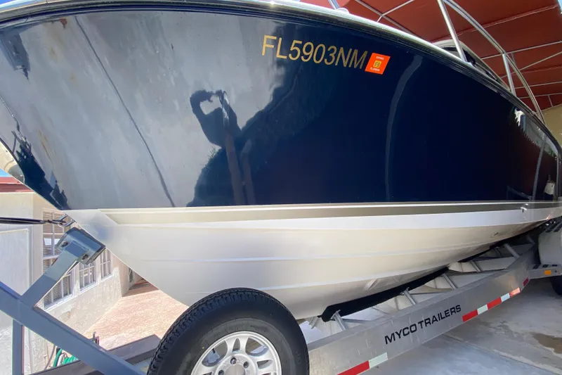 Slide: The Image of 2006 Pursuit 3480 Drummond Island Runner boat on trailer, side view. - 10