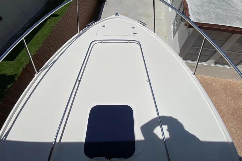Slide: The Image of 2006 Pursuit 3480 Drummond Island Runner boat deck with railing and hatch. - 14