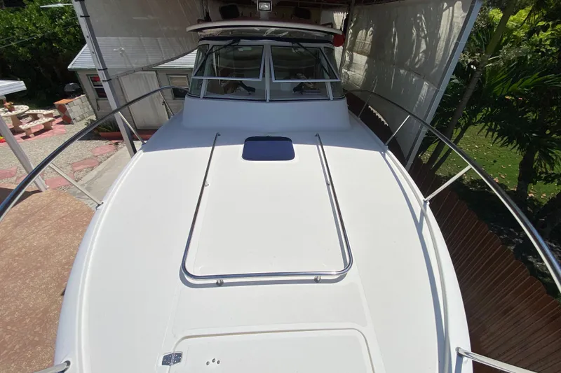Slide: The Image of 2006 Pursuit 3480 Drummond Island Runner boat deck, featuring sleek design and spacious layout. - 15