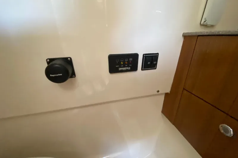 Slide: The Image of Control panel inside 2006 Pursuit 3480 Drummond Island Runner boat cabin. - 34