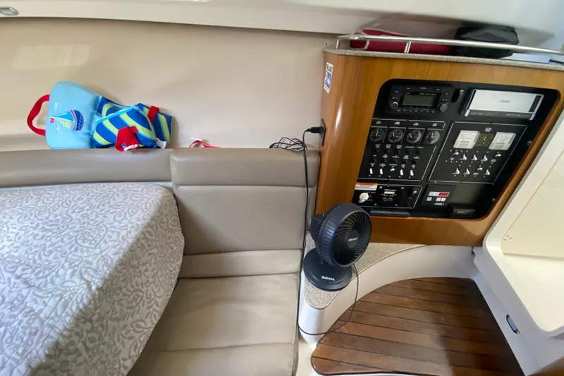 Slide: The Image of Interior of 2006 Pursuit 3480 Drummond Island Runner with control panel and seating area. - 35