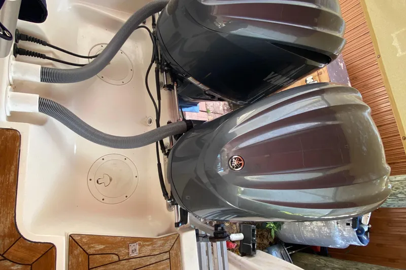 Slide: The Image of Twin Yamaha outboard engines on a 2006 Pursuit 3480 Drummond Island Runner boat. - 40
