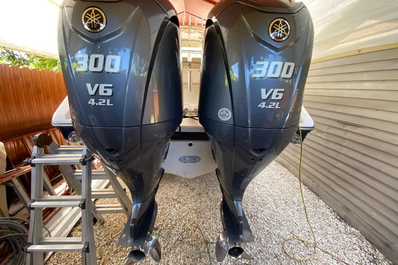 Slide: The Image of Twin Yamaha 300 V6 4.2L outboard engines on a 2006 Pursuit 3480 Drummond Island Runner. - 41