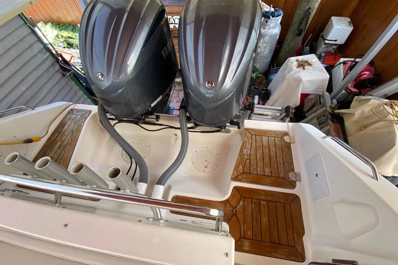 Slide: The Image of 2006 Pursuit 3480 Drummond Island Runner with dual Yamaha outboard engines and teak flooring. - 43