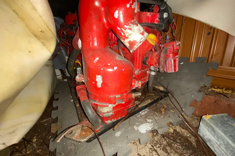 Slide: The Image of Red engine component of a 2006 Pursuit 3480 Drummond Island Runner boat. - 45