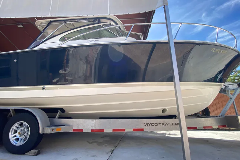 Slide: The Image of 2006 Pursuit 3480 Drummond Island Runner boat on trailer, side view. - 8