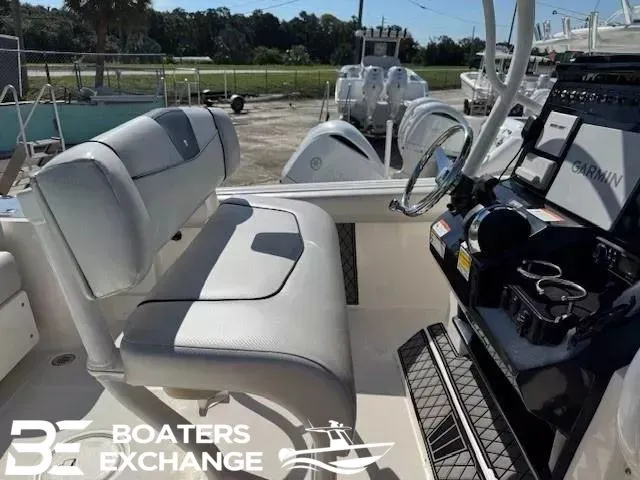 Slide: The Image of 2018 Wellcraft 242 Fisherman boat interior with seating and control panel at Boaters Exchange. - 6