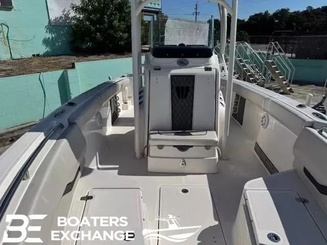 Slide: The Image of 2018 Wellcraft 242 Fisherman boat interior with seating and storage, displayed at Boaters Exchange. - 7