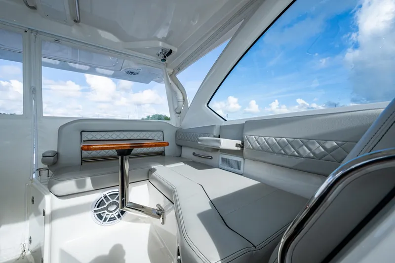 Slide: The Image of 2022 Pursuit OS 355 Offshore interior with luxurious seating and elegant design. - 35