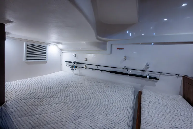 Slide: The Image of 2022 Pursuit OS 355 Offshore cabin interior with wooden finish and modern design. - 49