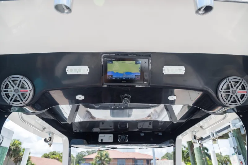 Slide: The Image of 2016 Edgewater 368CC boat dashboard with speakers and navigation screen. - 10