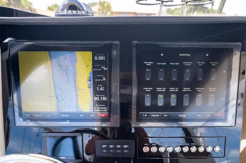 Slide: The Image of Dashboard of a 2016 Edgewater 368CC boat with navigation and control screens. - 17