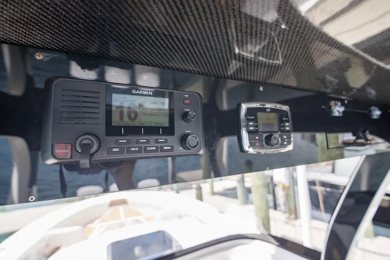 Slide: The Image of 2016 Edgewater 368CC boat dashboard with Garmin marine electronics. - 18