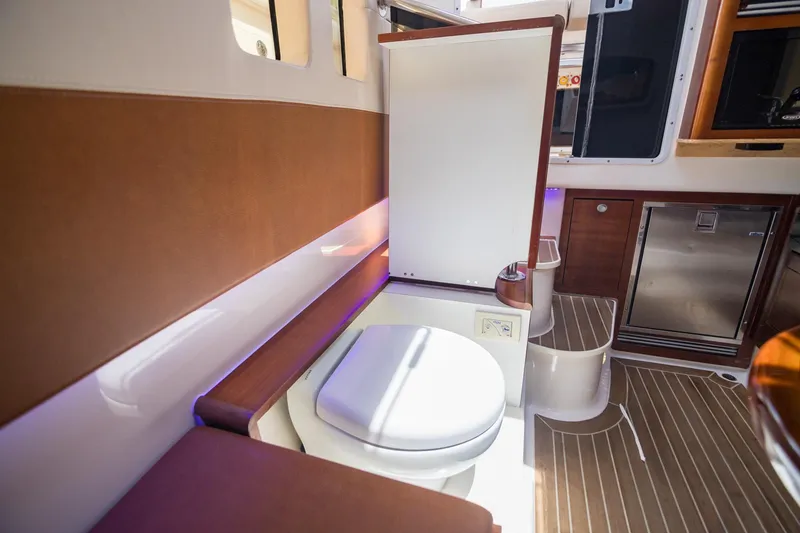 Slide: The Image of Luxurious 2016 Edgewater 368CC boat interior with modern bathroom amenities. - 27
