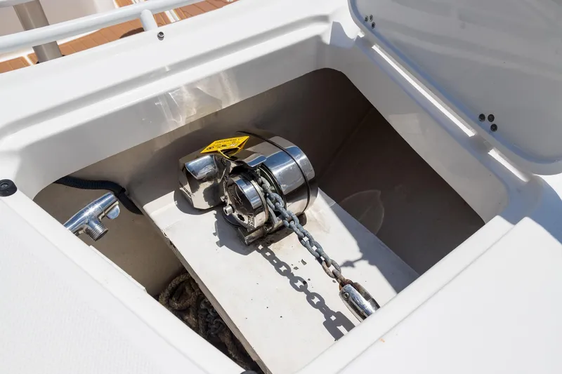 Slide: The Image of Anchor compartment of 2016 Edgewater 368CC boat with chain and winch. - 35