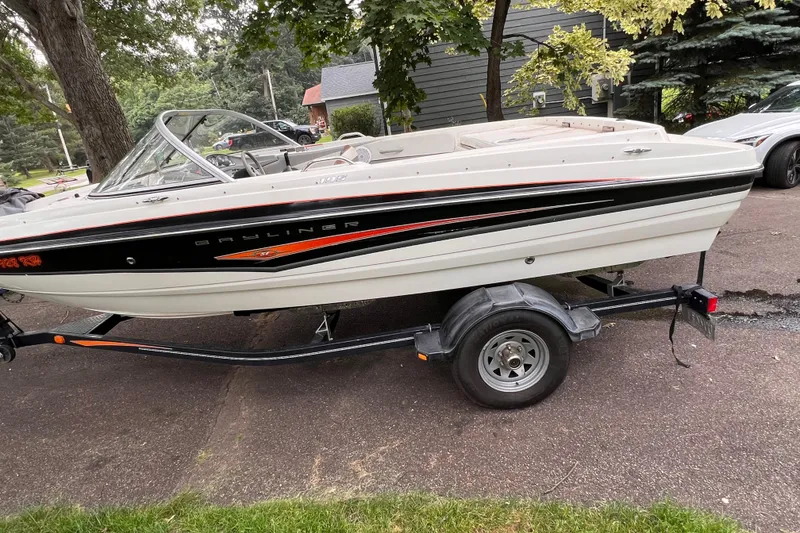 Slide: The Image of 2007 Bayliner 195 Fishing Ski boat on trailer, parked outdoors. - 3