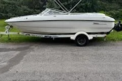 Slide: The Image of 2002 Chaparral 200 SSe boat on trailer, parked outdoors. - 4