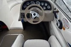 Slide: The Image of 2002 Chaparral 200 SSe boat interior with steering wheel and dashboard controls. - 7