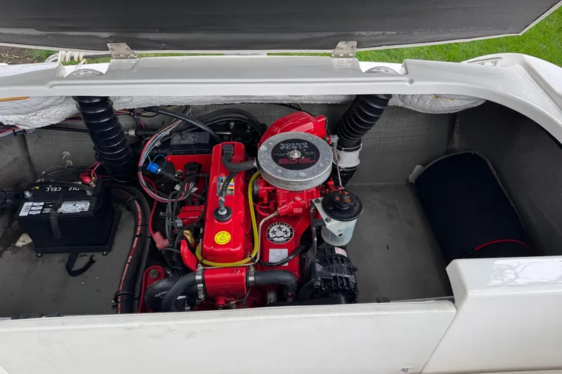 Slide: The Image of 1997 Seadoo Challenger engine compartment with red engine and battery. - 4