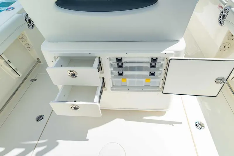 Slide: The Image of Manufacturer Provided Image: 2023 Cobia 240 Center Console storage compartments and drawers. - 13