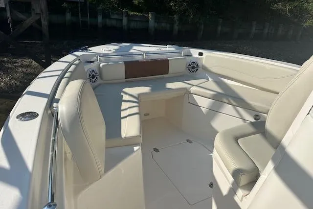 Slide: The Image of 2023 Cobia 240 Center Console boat interior with seating and speakers. - 15