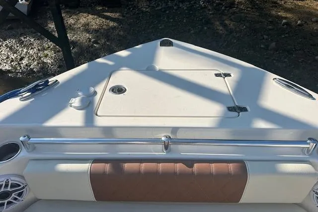 Slide: The Image of 2023 Cobia 240 Center Console boat bow with storage compartment and seating. - 18