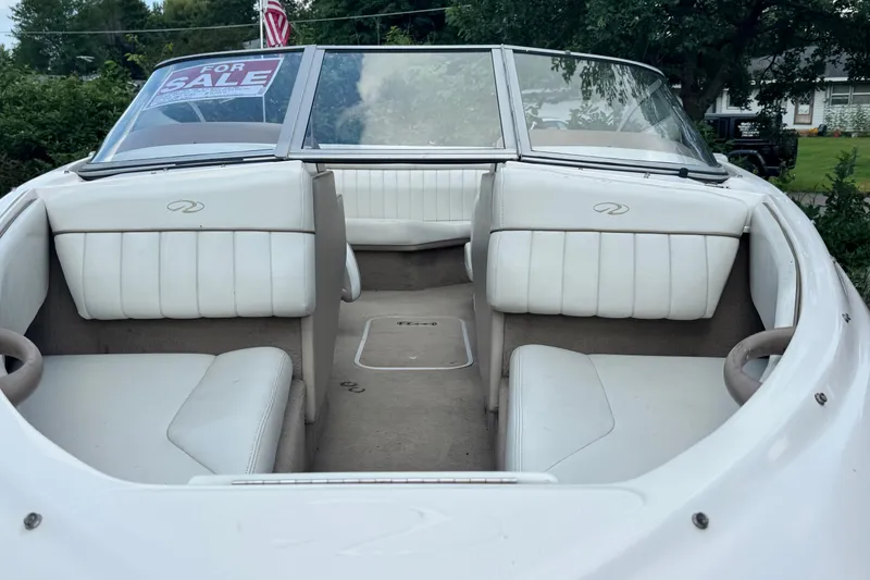 Slide: The Image of 2004 Regal 1800 LSR boat interior with "For Sale" sign, white seating. - 5