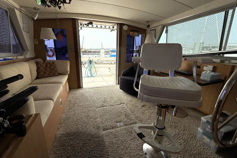 Slide: The Image of Interior of a 1978 Bertram 42 Convertible yacht with seating and helm. - 13