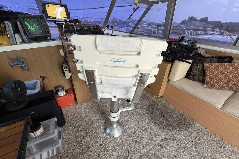 Slide: The Image of Interior of a 1978 Bertram 42 Convertible boat with helm and seating area. - 16