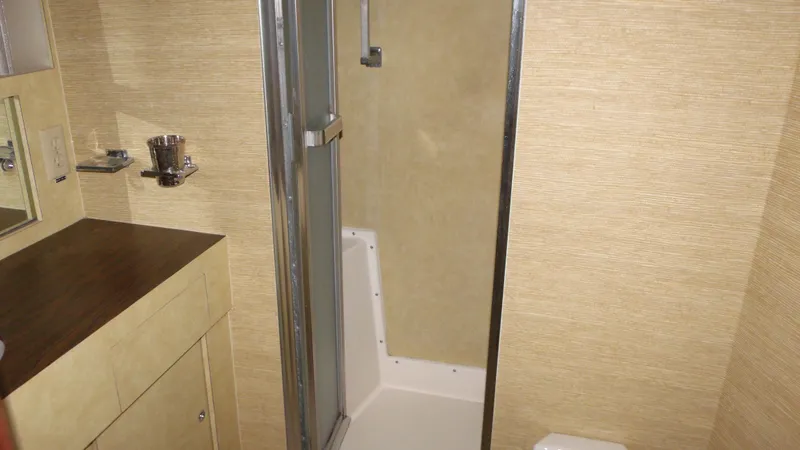 Slide: The Image of 1978 Bertram 42 Convertible yacht bathroom with shower and vanity. - 26