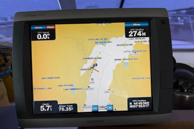 Slide: The Image of Garmin GPS display on a 1978 Bertram 42 Convertible, showing navigation map and data. - 34