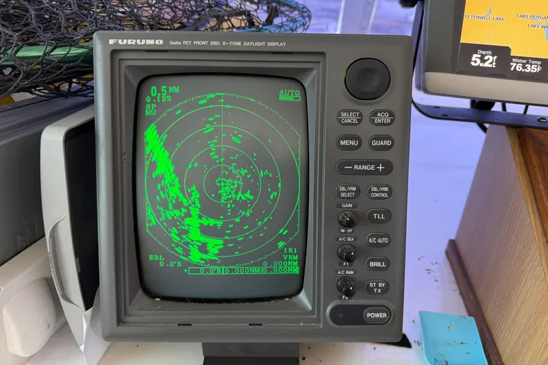 Slide: The Image of Furuno radar display on a 1978 Bertram 42 Convertible boat, showing navigation data. - 35