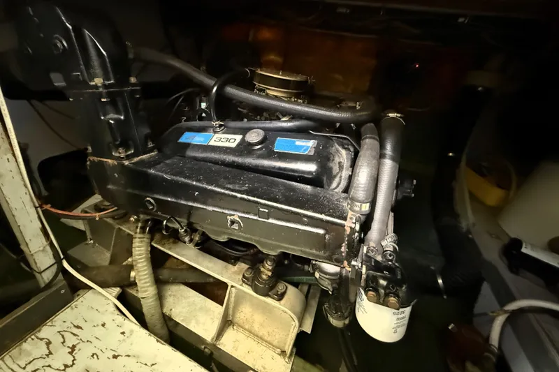 Slide: The Image of Engine compartment of a 1978 Bertram 42 Convertible boat, showcasing mechanical components. - 44