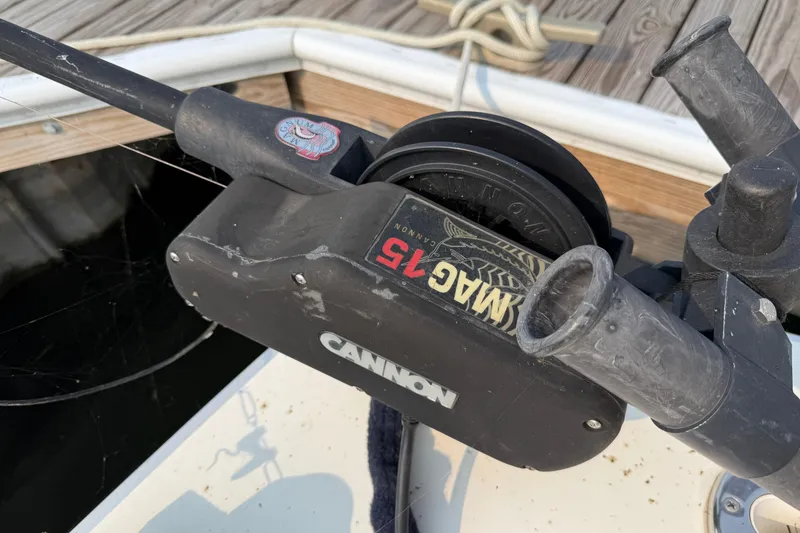 Slide: The Image of Fishing equipment on a 1978 Bertram 42 Convertible boat, featuring a Cannon Mag 15 downrigger. - 48