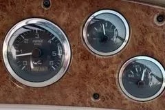 Slide: The Image of Close-up of Sea Ray 340 Sundancer dashboard gauges on a wood grain panel. - 10
