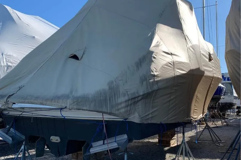 Slide: The Image of Covered 2000 Sea Ray 340 Sundancer boat on stands, ready for storage. - 13