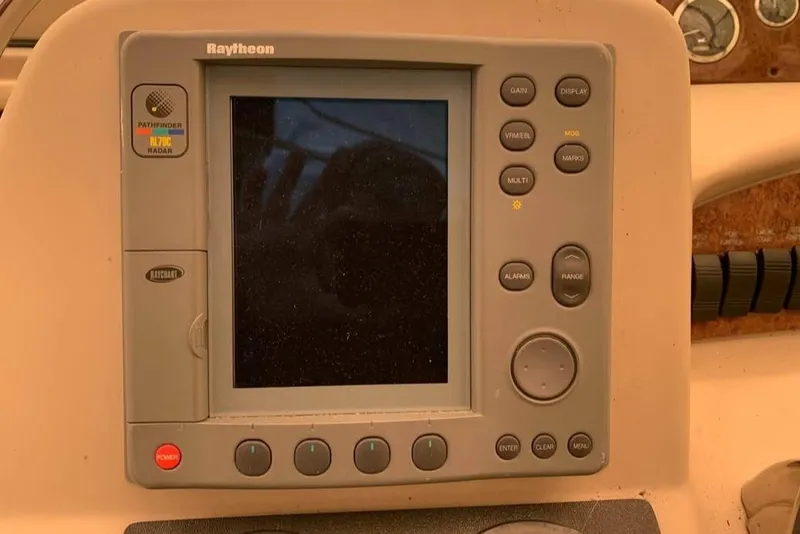 Slide: The Image of Raytheon marine navigation system on 2000 Sea Ray 340 Sundancer boat dashboard. - 15