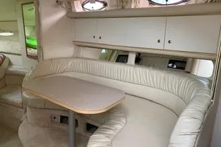 Slide: The Image of Interior of Sea Ray 340 Sundancer with curved seating and table. - 2