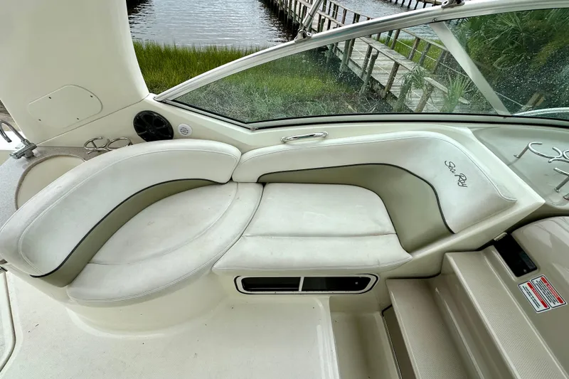 Slide: The Image of Interior seating of 2006 Sea Ray 260 Sundancer boat with waterfront view. - 20