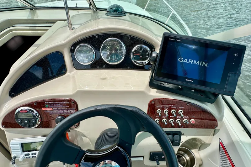Slide: The Image of Dashboard of a 2006 Sea Ray 260 Sundancer with Garmin navigation system. - 23