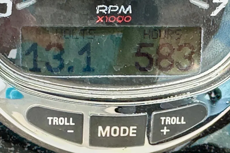 Slide: The Image of Close-up of a 2006 Sea Ray 260 Sundancer RPM gauge displaying 13.1 and 583 hours. - 26