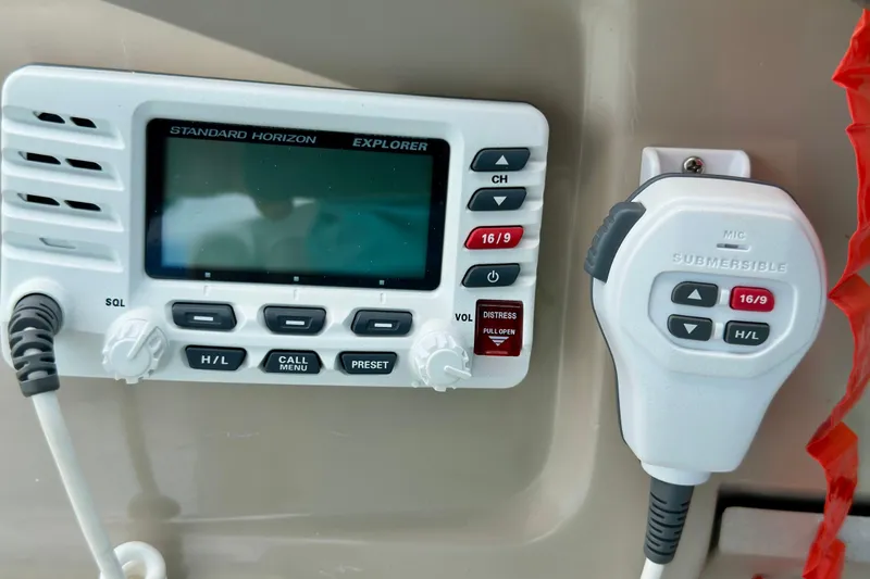 Slide: The Image of VHF marine radio on 2006 Sea Ray 260 Sundancer boat dashboard. - 27