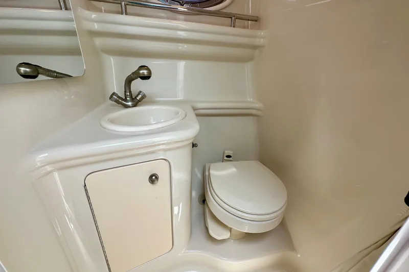 Slide: The Image of 2006 Sea Ray 260 Sundancer bathroom with sink and toilet. - 40