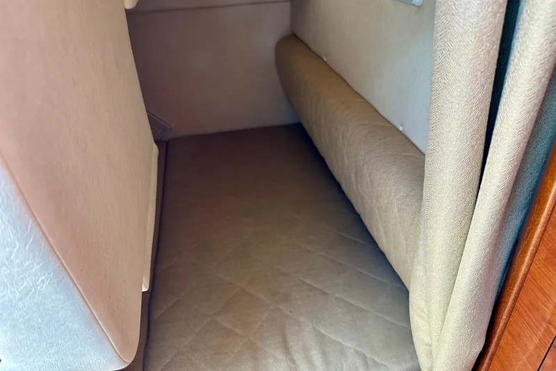 Slide: The Image of Interior cabin of 2006 Sea Ray 260 Sundancer with beige upholstery. - 44