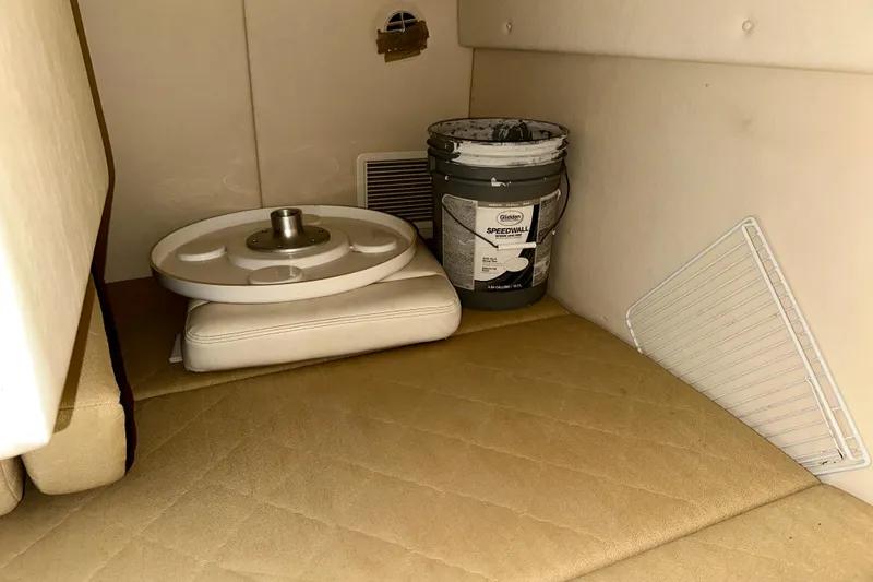 Slide: The Image of Interior of 2006 Sea Ray 260 Sundancer with paint bucket and table base. - 45