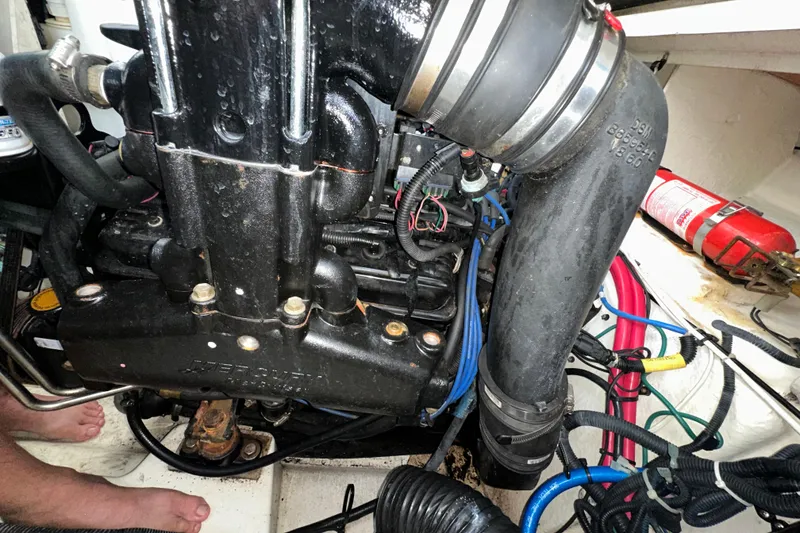 Slide: The Image of Engine compartment of a 2006 Sea Ray 260 Sundancer boat with visible components and wiring. - 49