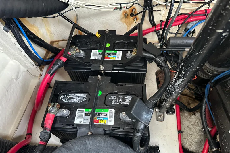 Slide: The Image of Battery compartment of a 2006 Sea Ray 260 Sundancer with wiring and connections. - 53